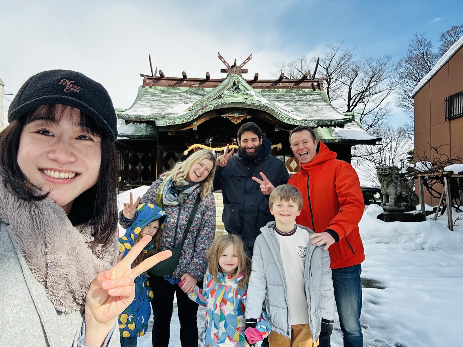 Yuri with a guest family at a Kanazawa shrine